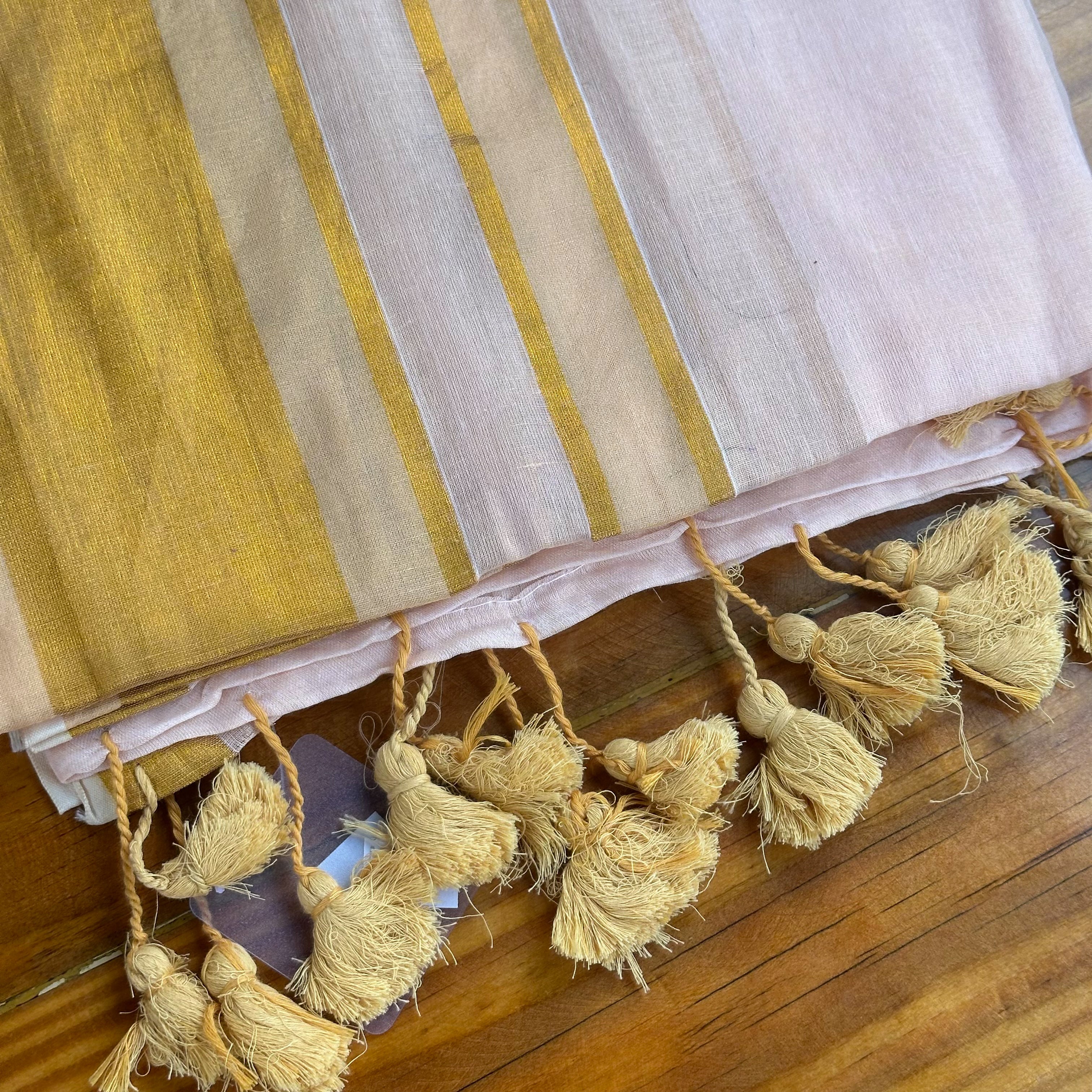 🤍Blush White Mul Cotton Saree with Gold Zari Stripe Border & Natural Tassels🤍