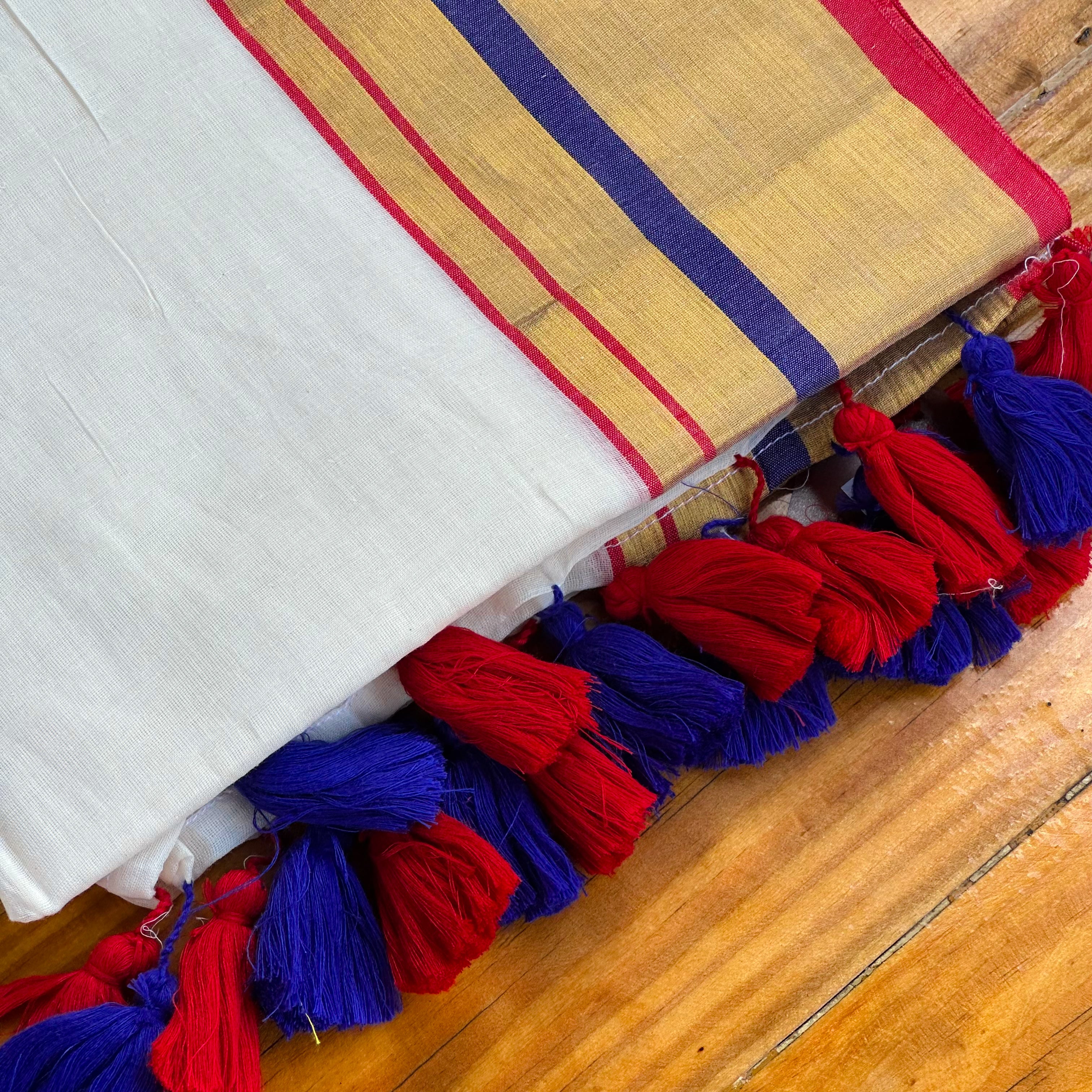 🤍Pristine White & Gold Saree with Royal Blue & Red Stripes and Dual-Tone Tassels🤍