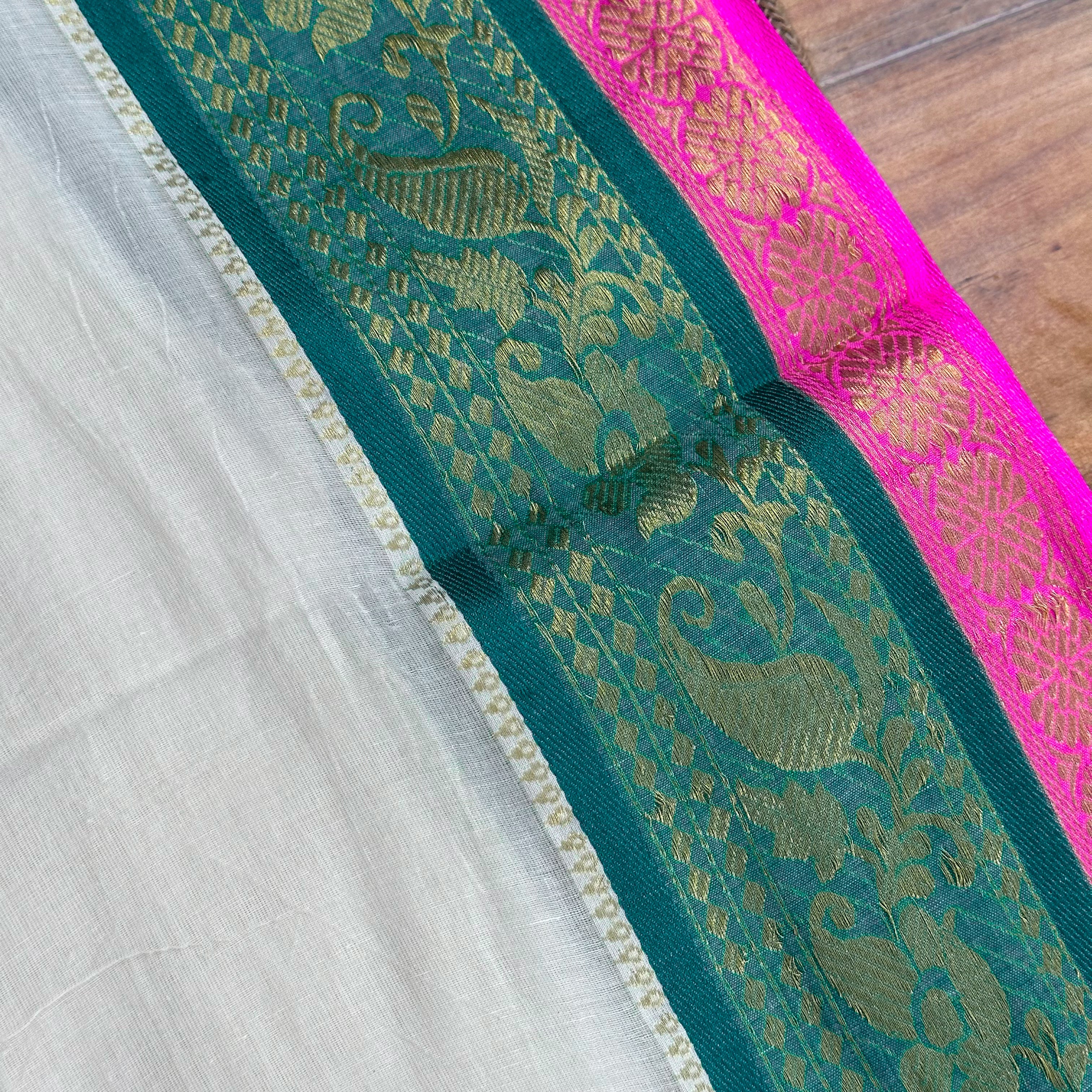 🩷Ivory & Fuchsia Brocade Saree with Teal Zari Border and Dual-Tone Tassels🩷